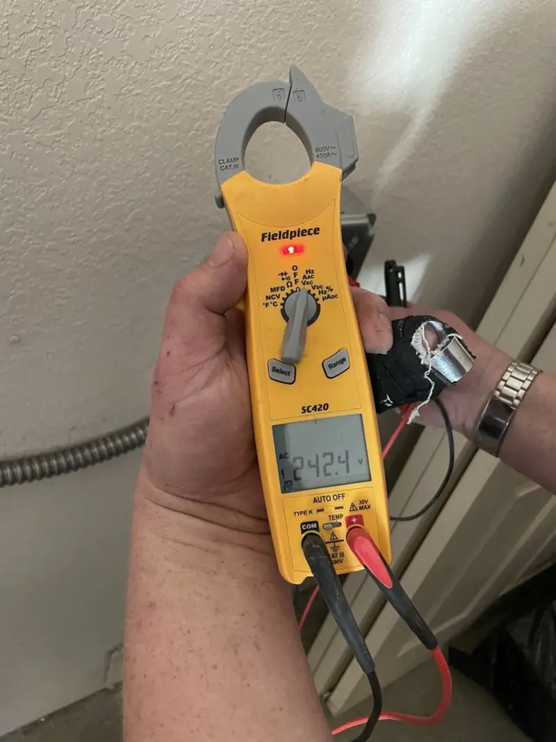 Voltage testing with clamp meter during Recessed Lighting Installation in Raritan